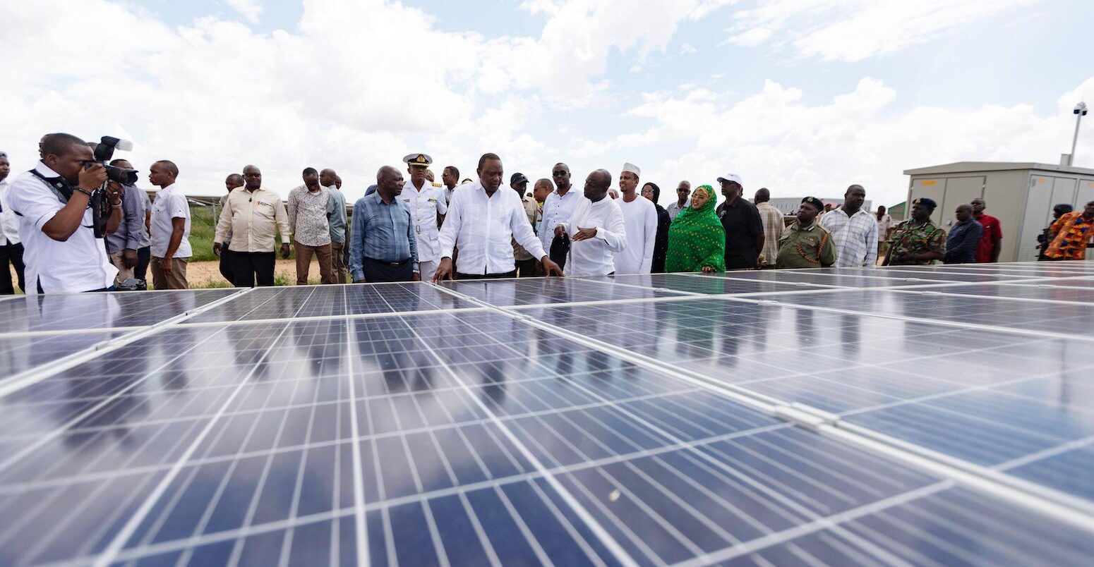 Kenyan President Uhuru Kenyatta C attends the launching ceremony of a solar farm in Garissa, Kenya, 2019.