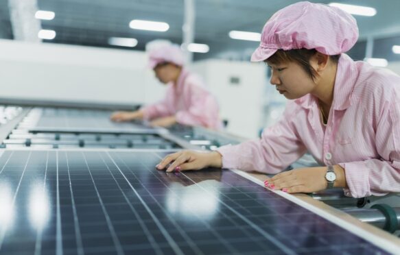 Female workers in solar panel assembly factory, Solar Valley, Dezhou, China.